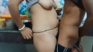 The wealthy boss's son gets in on the action with the maid in the kitchen
