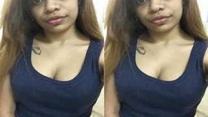 Watch a beautiful girl show off her big tits in this steamy video