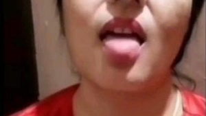 An Indian wife reveals her large breasts and intimate area in this sensual video