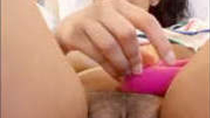 Aroused woman pleasuring herself with a vibrator in the snow