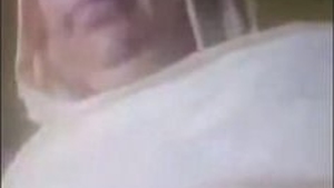 A mature Pakistani woman displays her assets to an older man
