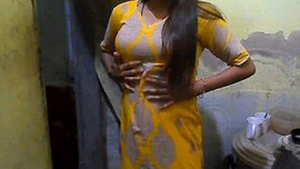 A captivating girl from an Indian village proudly displays her large breasts