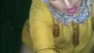 Sensual bhabhi in hijab gives a passionate blowjob with a unique twist