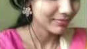 A blonde woman showcases her large breasts in an arousing video chat