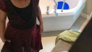 A mature Indian woman and her companion have a relaxing shower together
