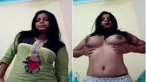 A beautiful girl indulges in self-pleasure with her breasts on camera