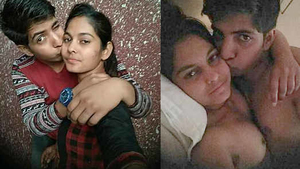 Indian couple shares a passionate kiss in bed