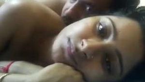 A South Asian wife pleasures herself with a cucumber and her fingers in her vagina