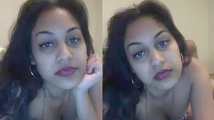 A South Asian woman pleasures herself with a black penis