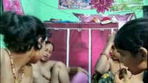 A group of prostitutes engage in sexual activities at a brothel