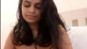 Aroused Indian woman uses Ohmibod vibrator on herself