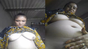 Curvy auntie flaunts her big boobs and pussy in front of the camera