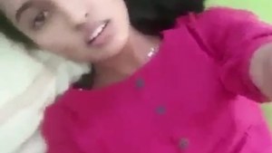 A Tamil beauty engages in explicit acts in a sensual recording