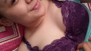 Desi girl in hijab reveals her breasts and engages in sexual activity
