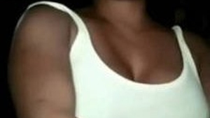 Arousing Indian woman reveals her large breasts and intimate area