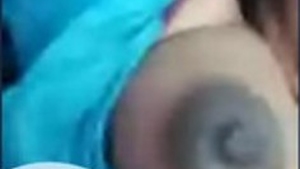 Desi aunty flaunts her large breasts on camera
