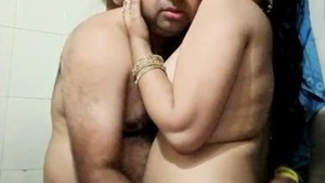 Watch as Bhabhi satisfies her husband's desires with her big boobs