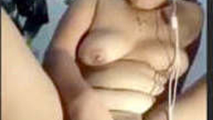 Horny girl masturbates with fingers and tongue in tribal video