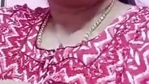 Amateur porn music video of the Desi housewife extracting milk from tits