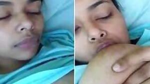 Indian aunty licks her own nipples and performs XXX masturbation show