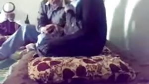 Family doctor examines woman in hijab