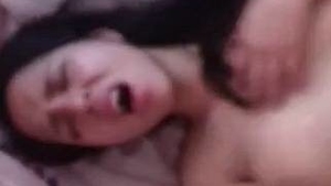 Watch a stunning girl reach climax in this steamy video