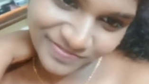 Tamil girl flaunts her breasts in a seductive manner