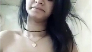 Aroused teen explores her body and big breasts in a solo session