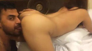 A tattooed Indian man uses his tongue skillfully to pleasure a woman