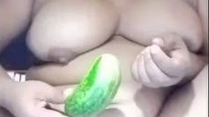 Married woman with big breasts uses cucumber for self-pleasure