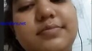 Cheeky Indian desi girl sticks her tongue out besides showing her big tits