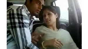 A young Indian woman pleasuring herself and performing oral sex in a vehicle