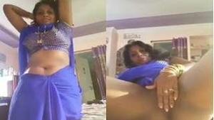 Watch a hot Tamil bhabhi tease and please with her pussy