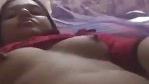 Well mannered Indian slut lies in bed with naked tits waiting for man