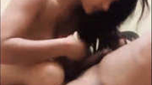 A stunning young Desi woman engages in oral and intercourse