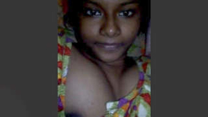 A charming Indian girl flaunts her ample bosom