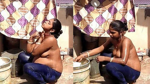 Indian aunt takes a bath outdoors