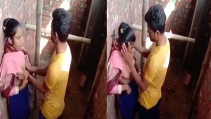 A girl from the Indian subcontinent performs oral sex on her partner while also fondling her breasts
