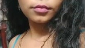 A naughty Indian wife reveals her breasts