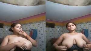 Desi bhabhi's big boobs and cigarette in village video