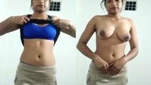 Exclusive video of a hot Indian babe exposing her breasts and pussy